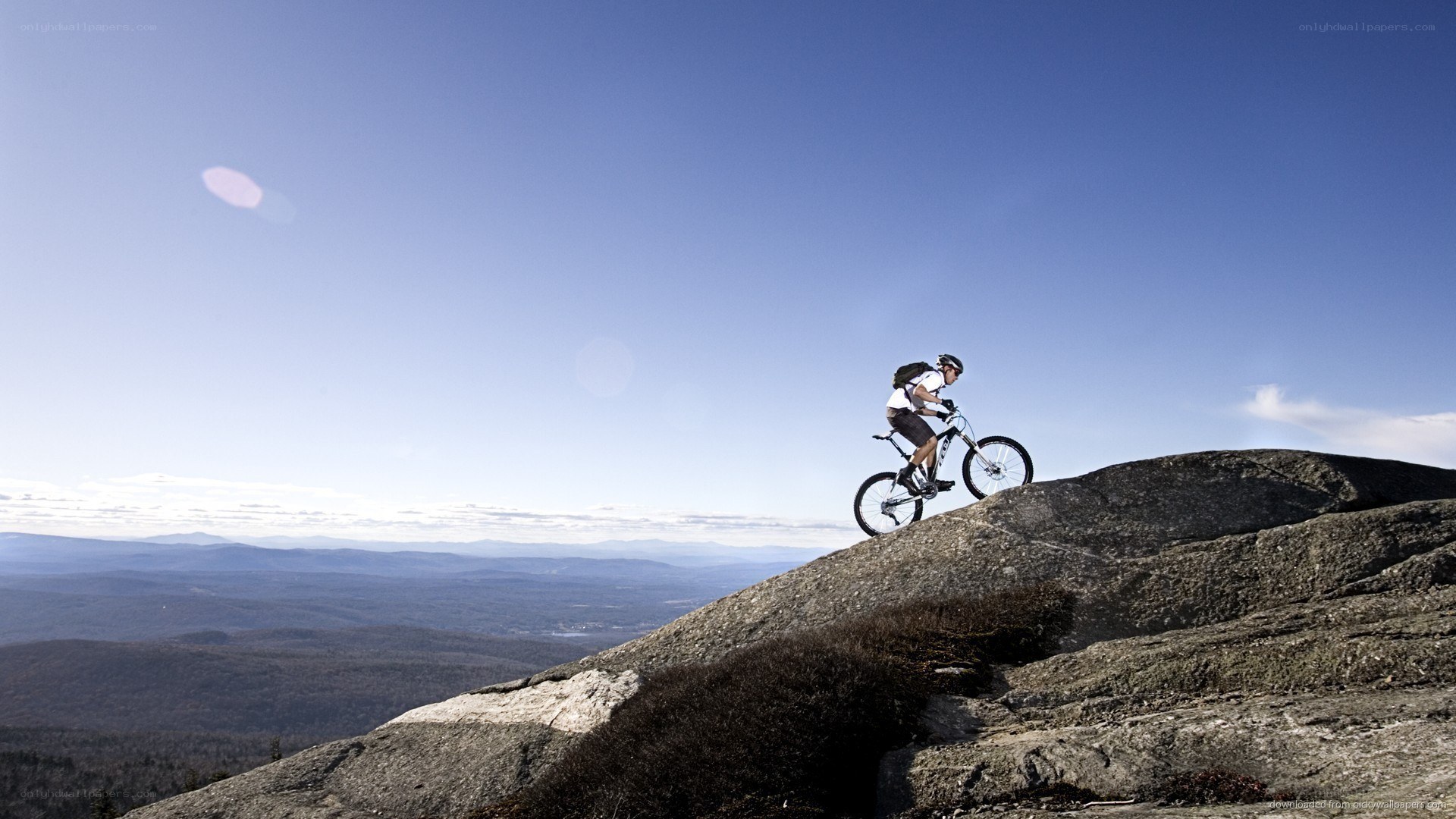 Mountain biker on rocky peak