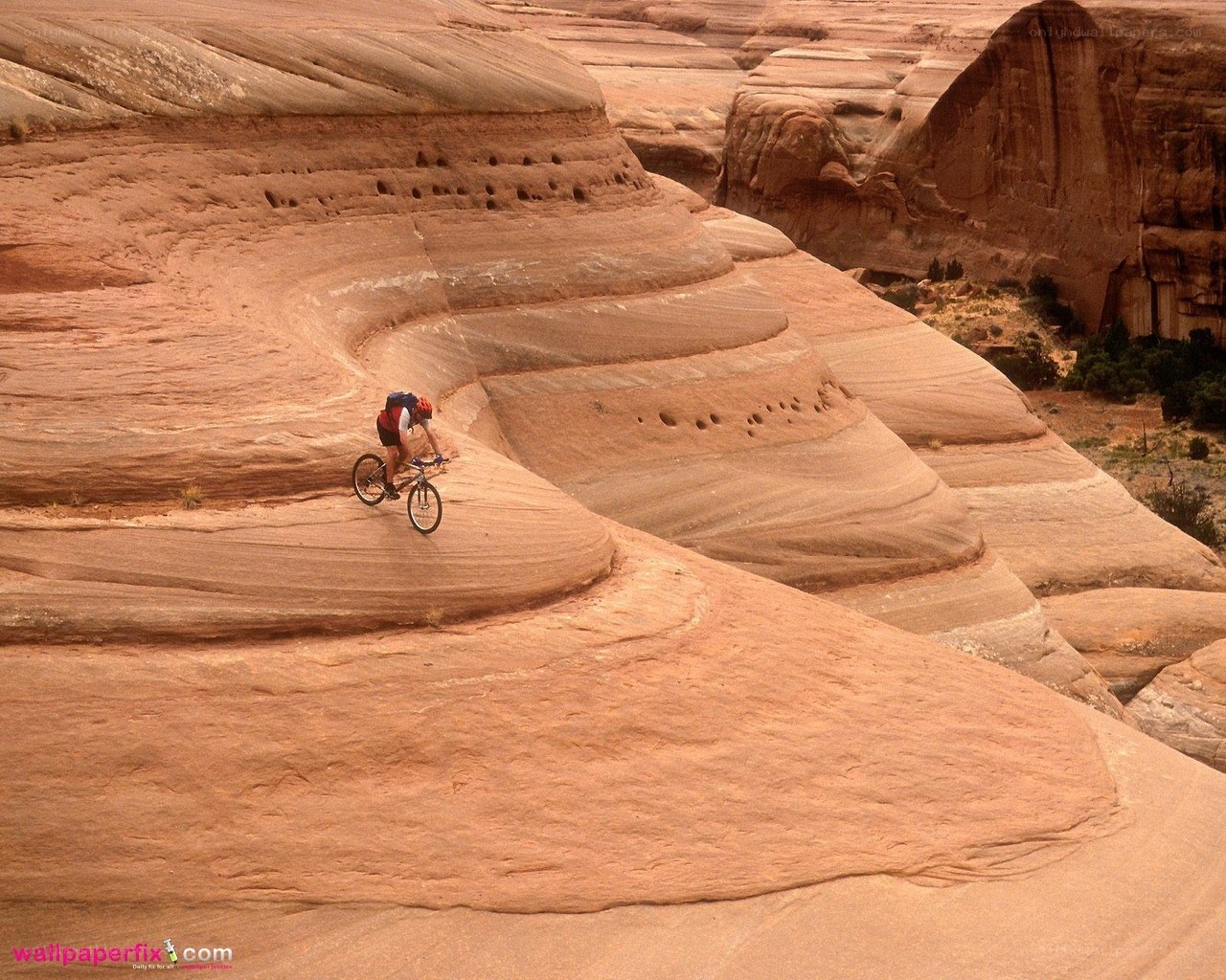 Mountain biker on sandstone