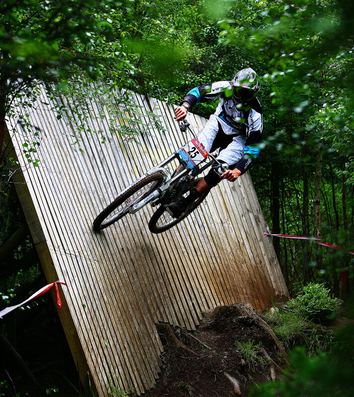 Mountain biker on wooden ramp