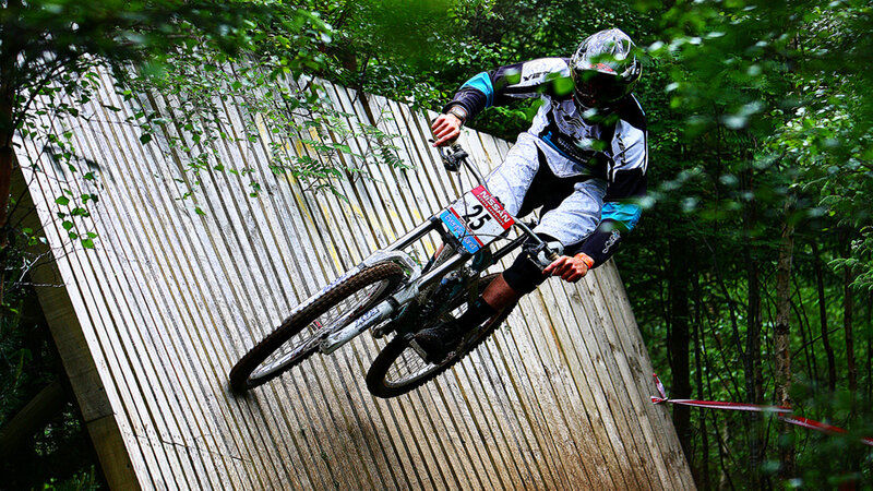 Mountain biker on wooden ramp