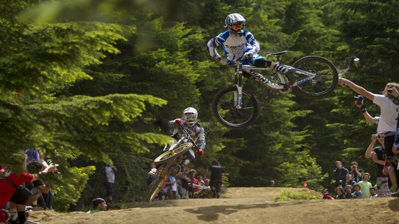 Mountain Bikers in Mid-air
