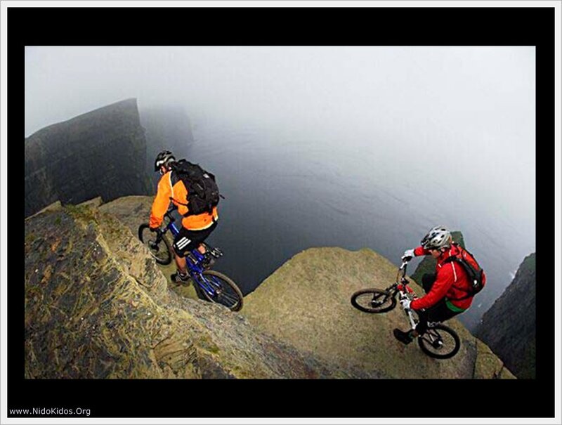 Mountain bikers on a cliff edge