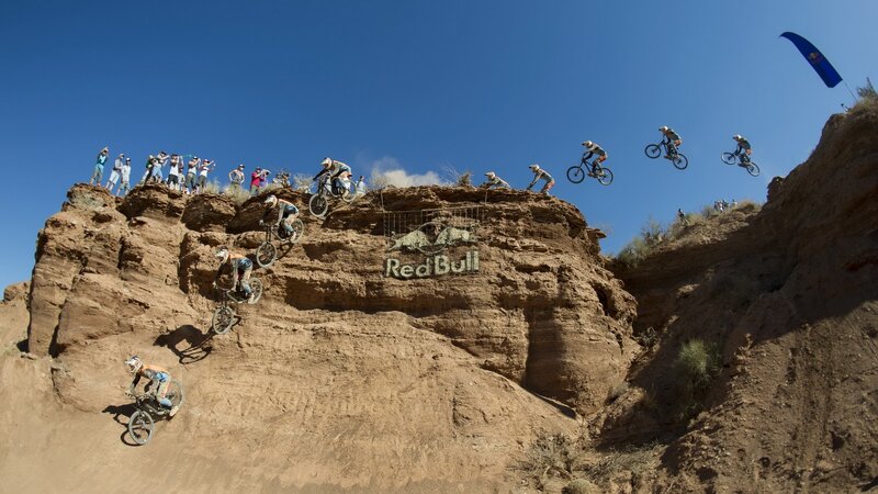 Mountain Bikers on Cliff — Brown