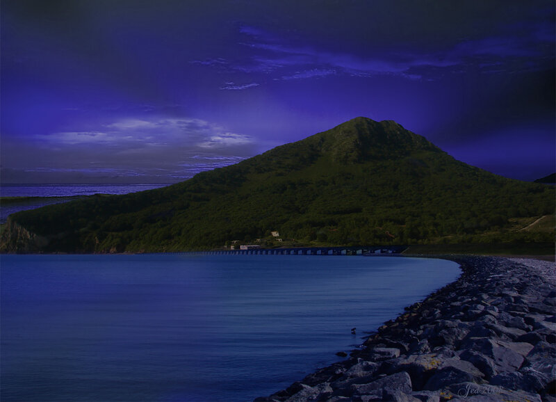Mountain by the sea at dusk