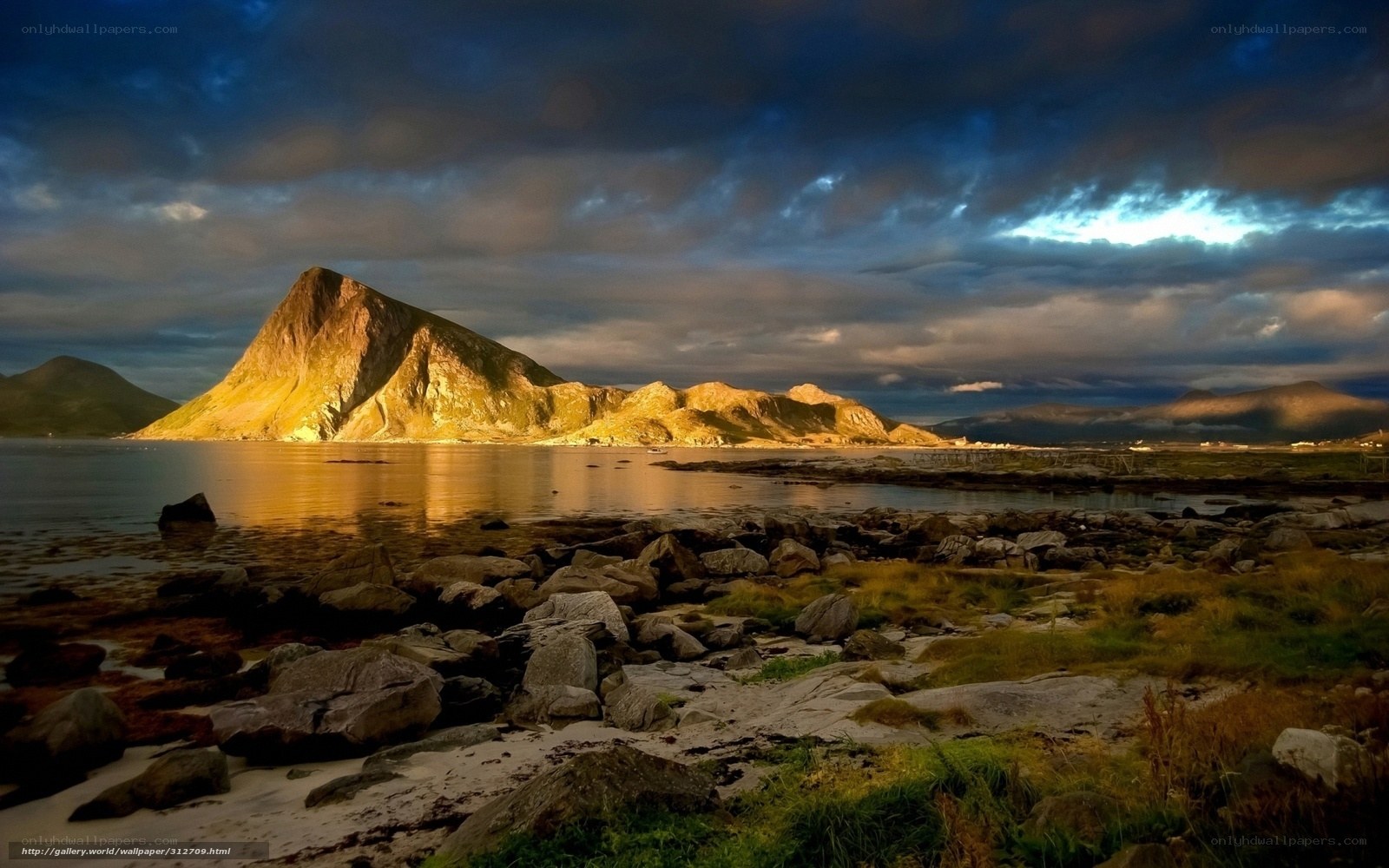 Mountain by the sea at sunset