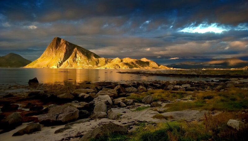 Mountain by the sea at sunset
