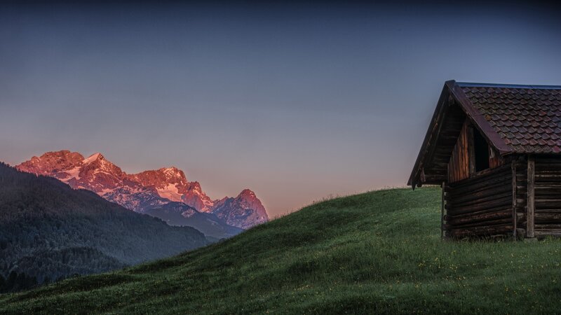 Mountain cabin at dawn