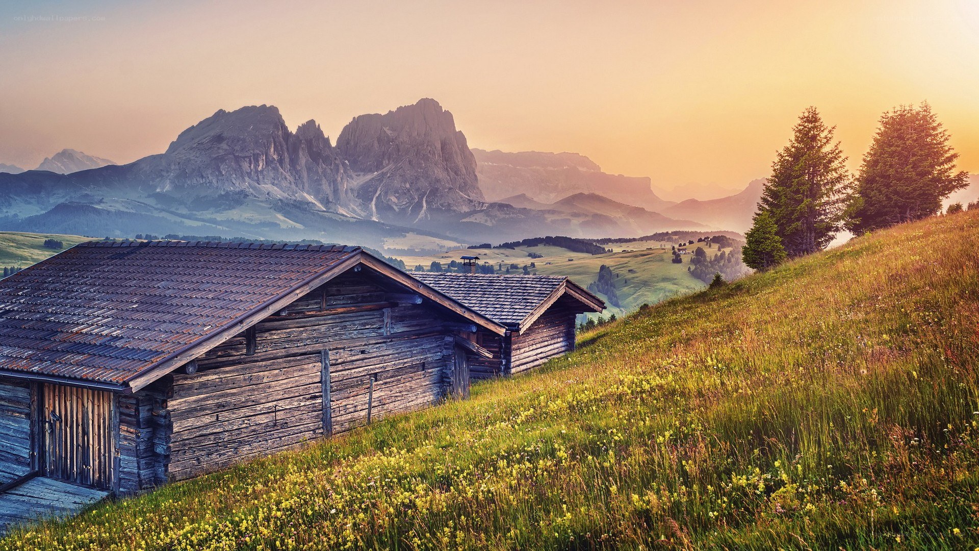 Mountain cabin at sunset