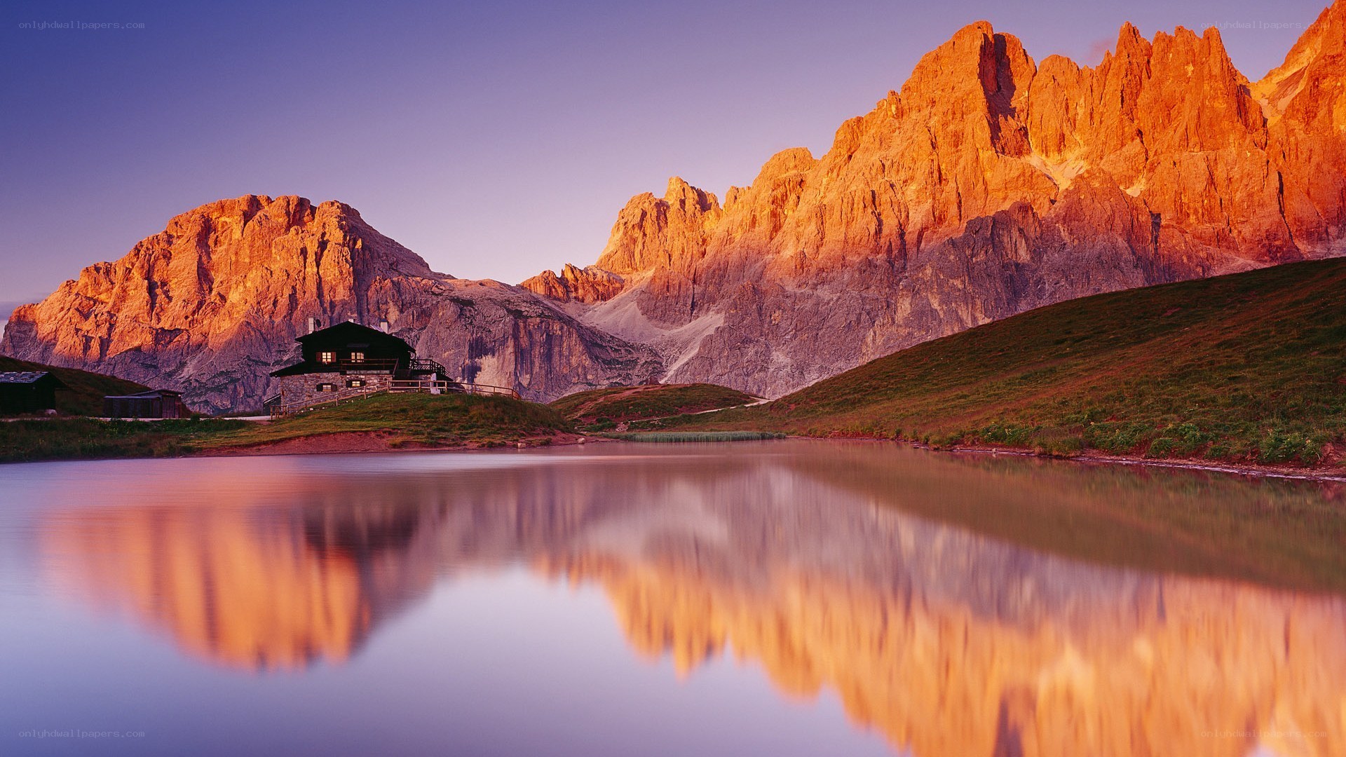 Mountain cabin at sunset