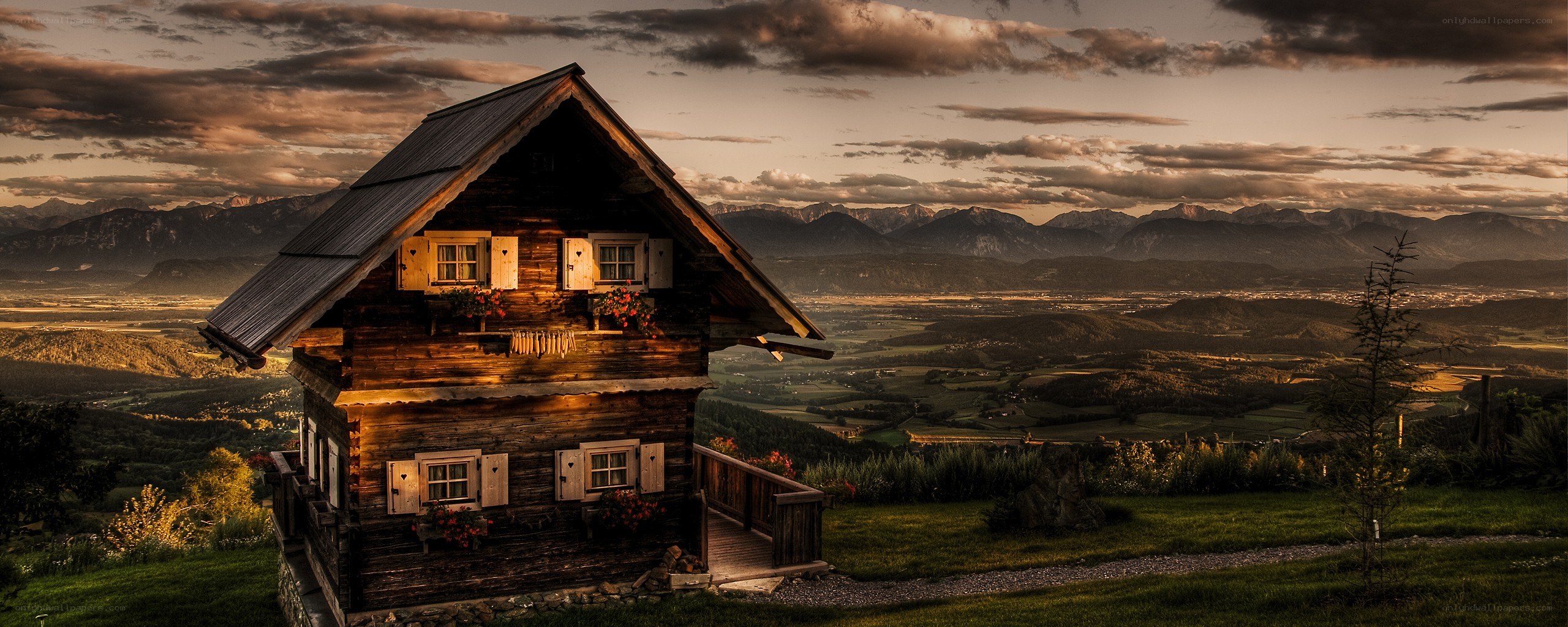 Mountain cabin at sunset