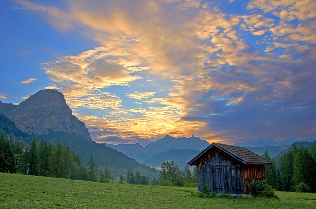 Mountain cabin at sunset