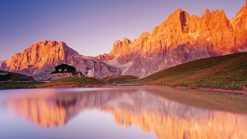 Mountain cabin at sunset