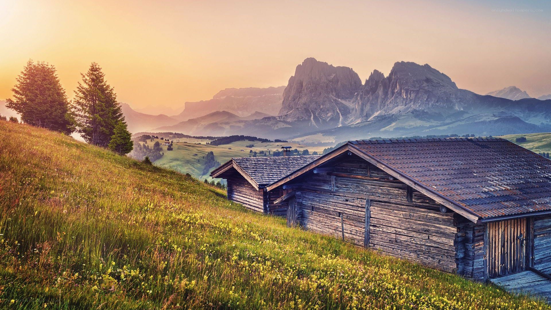 Mountain cabin at sunset