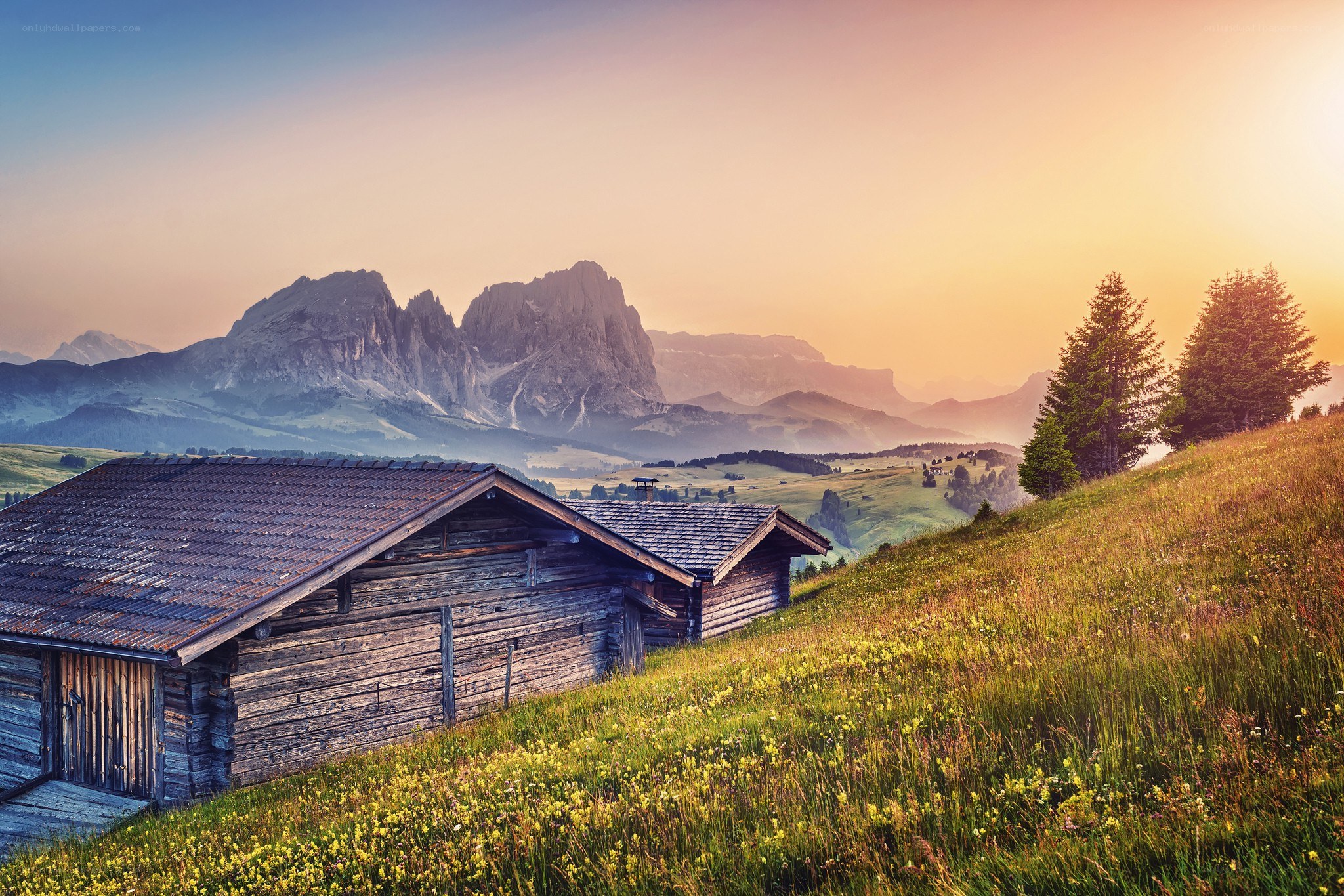 Mountain cabin at sunset