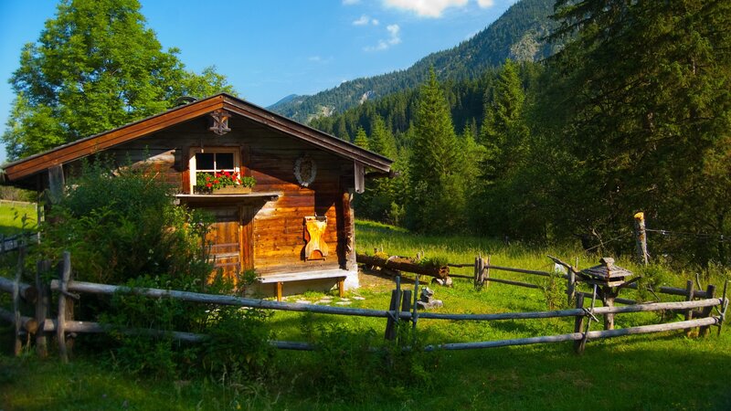 Mountain cabin in a green valley