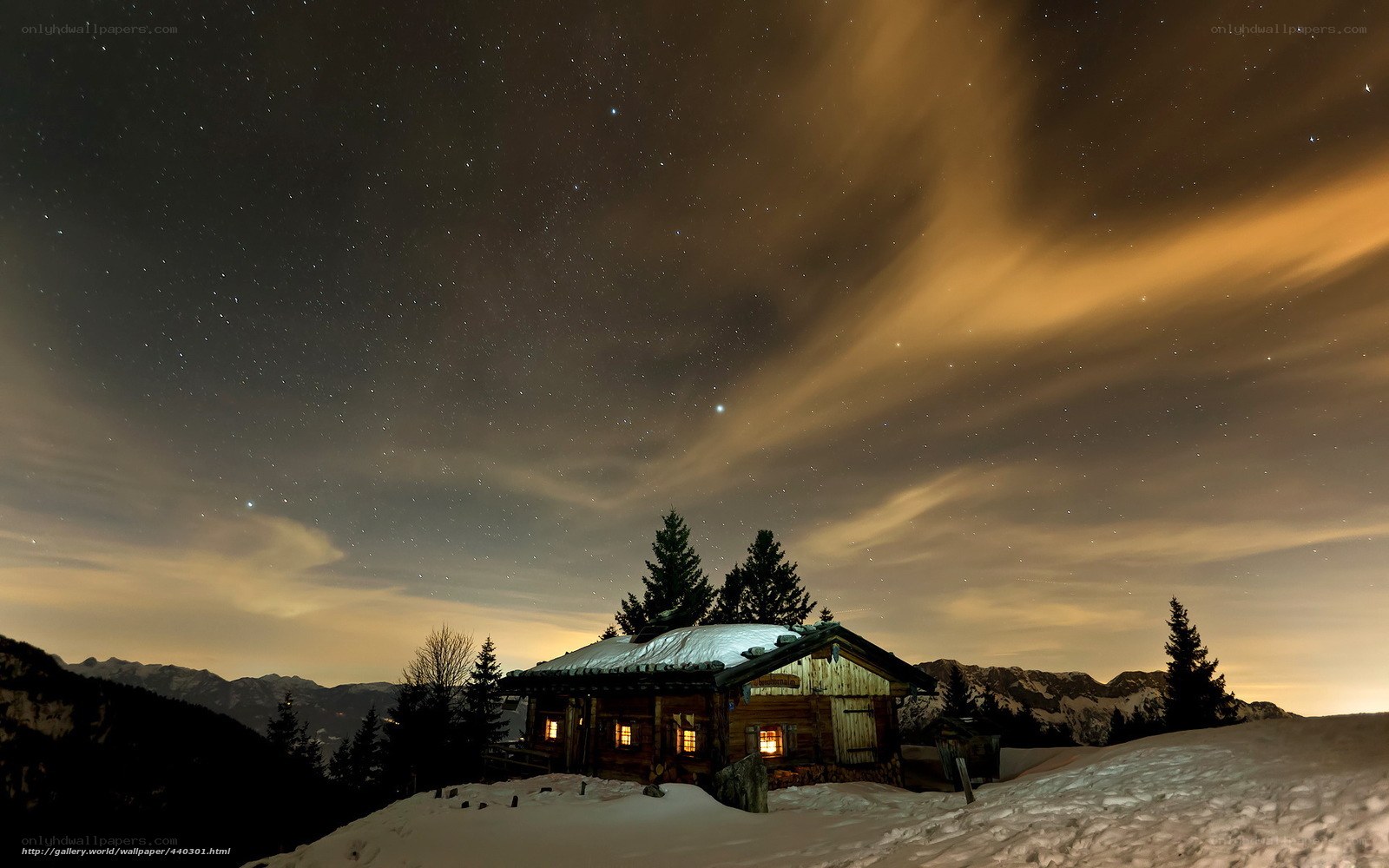 Mountain cabin under starry sky