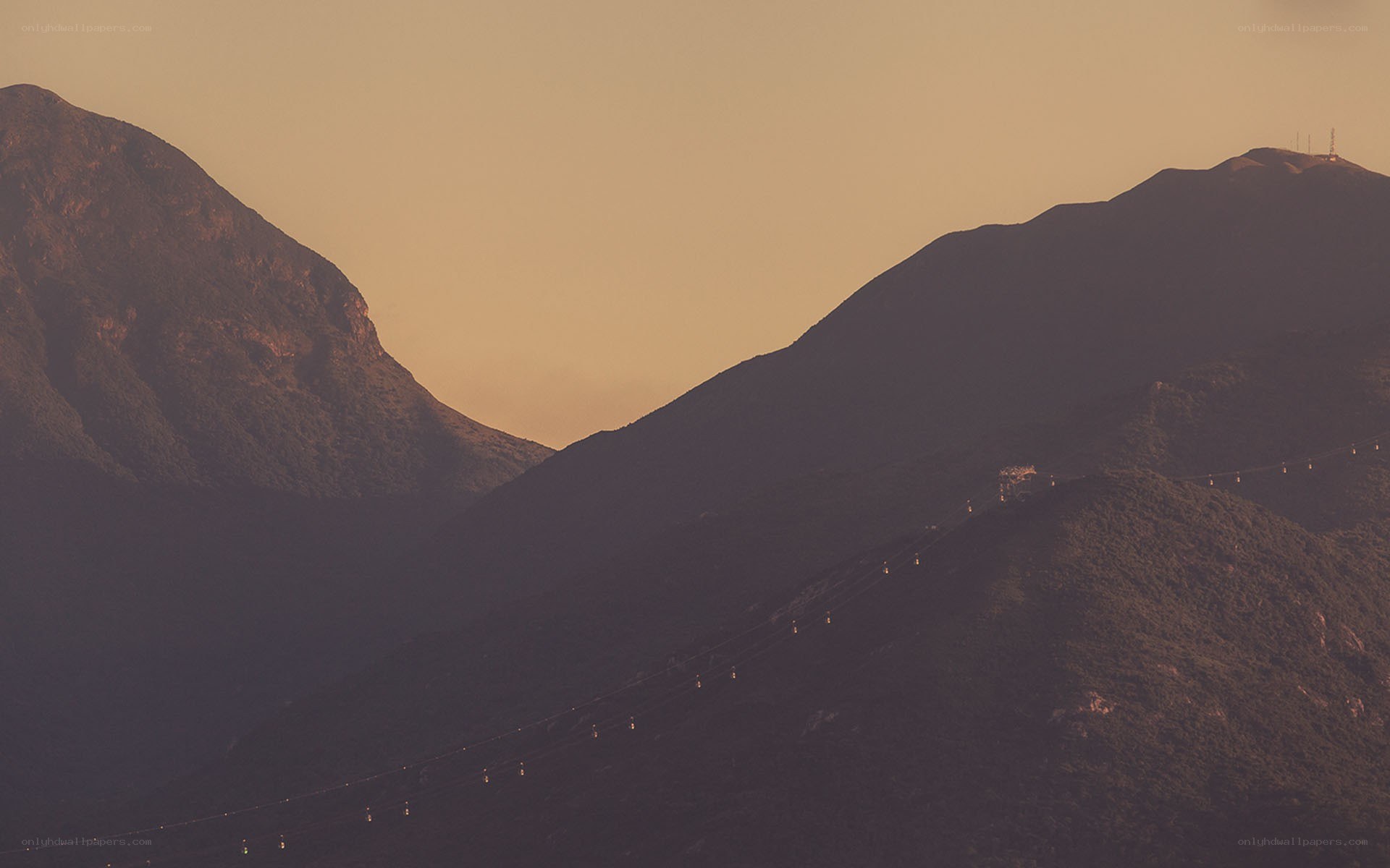 mountain cable car at sunset