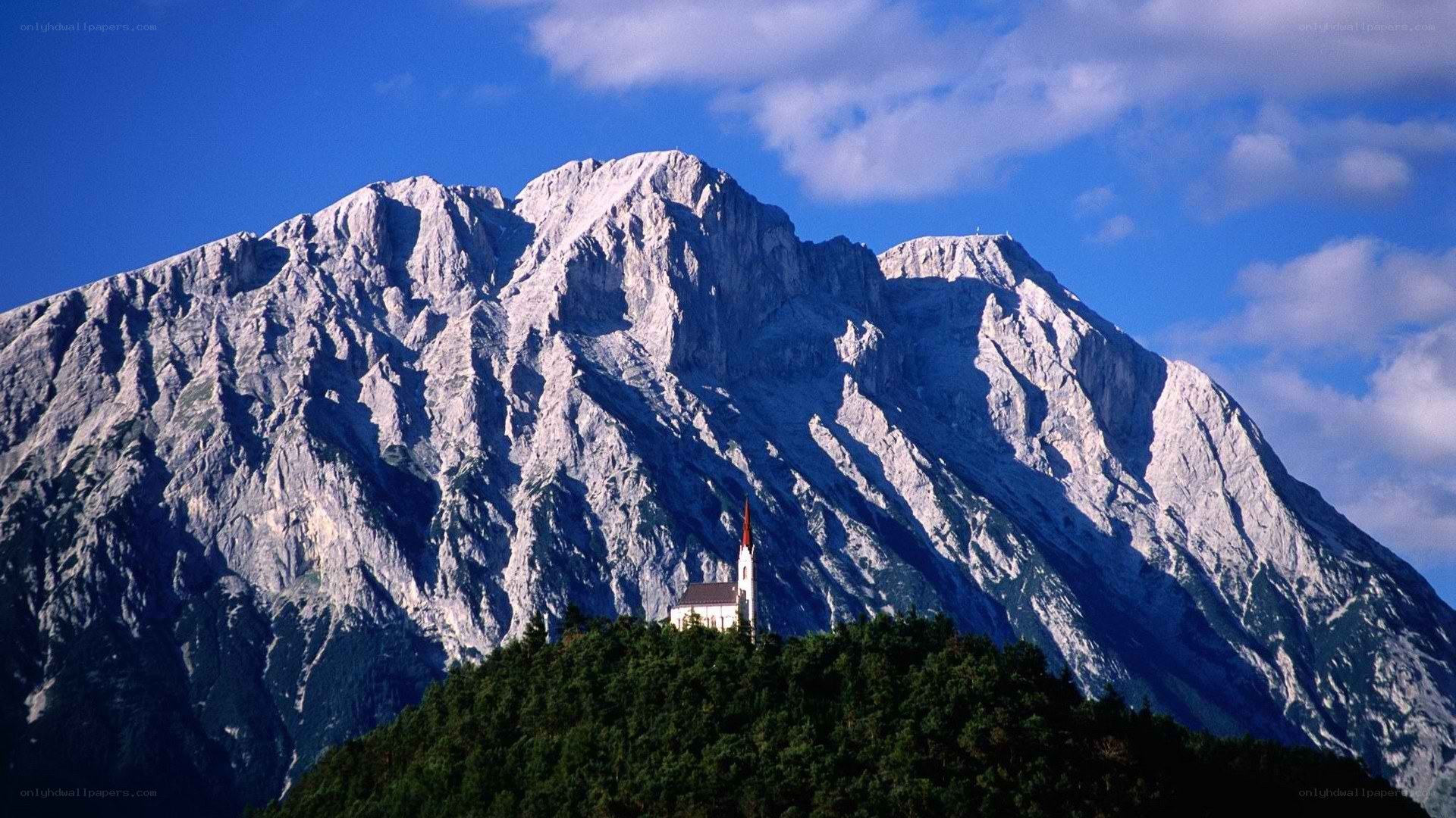Mountain church under blue sky