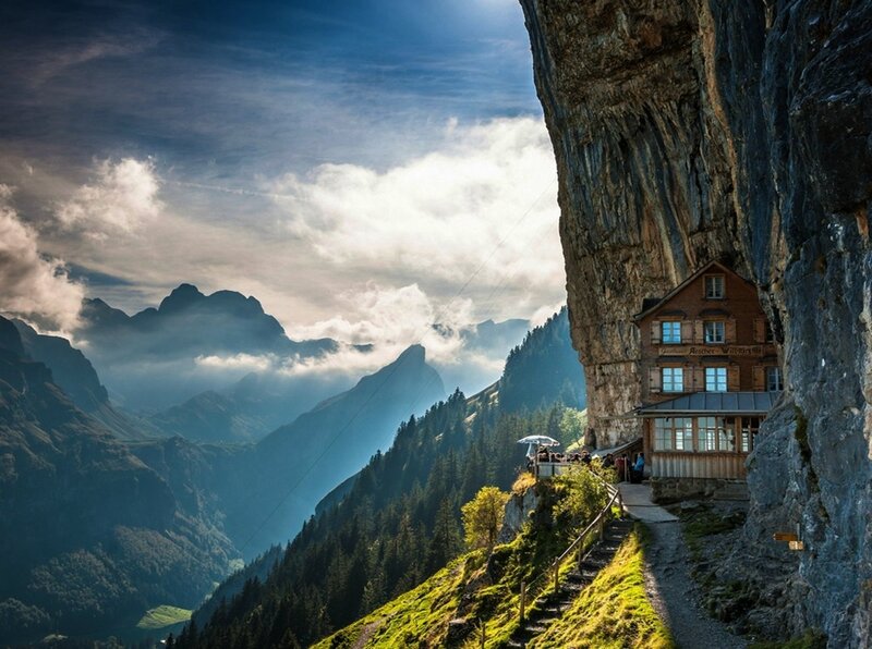 Mountain cliffside lodge with valley view