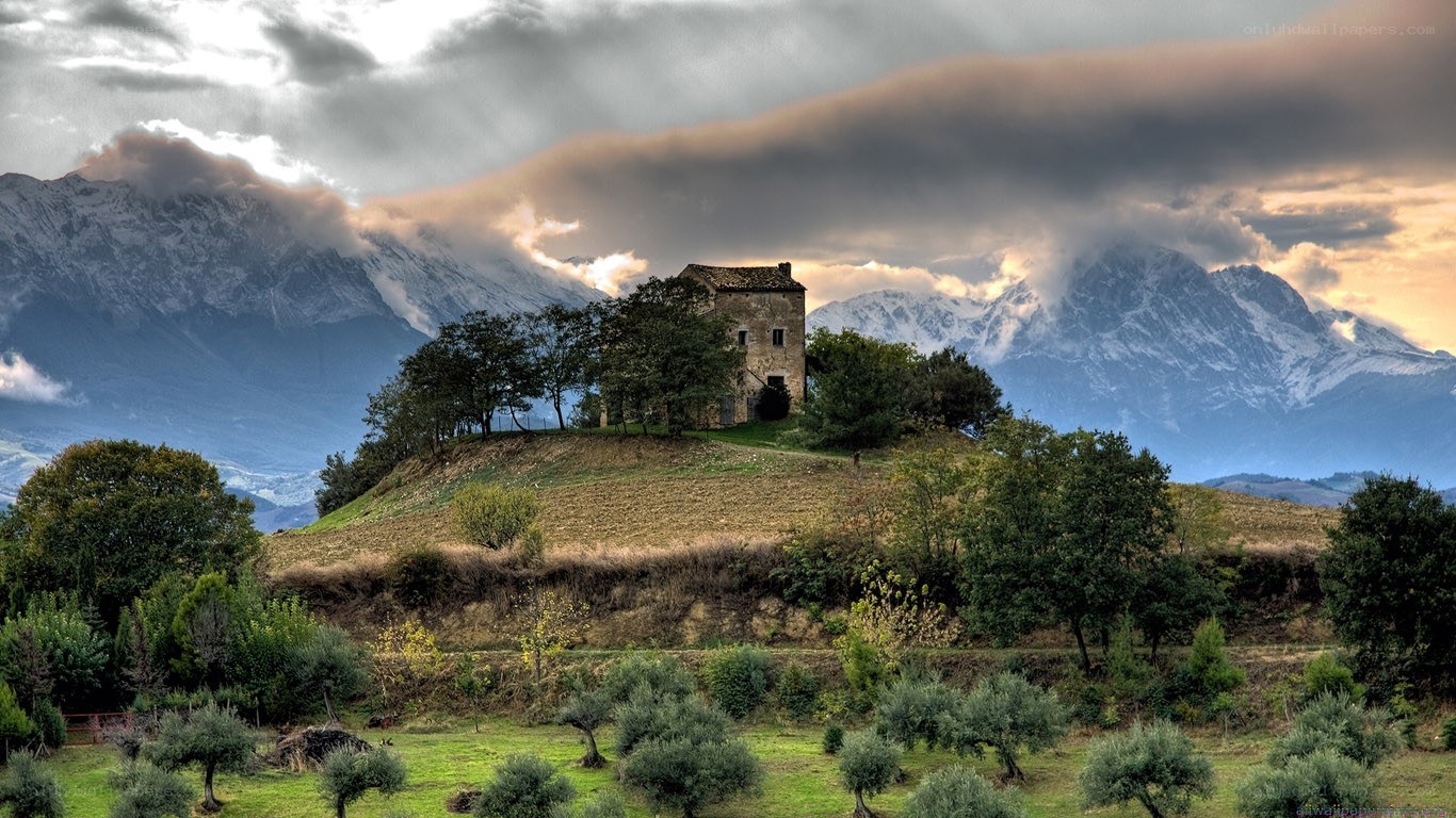 Mountain house with snow-capped peaks
