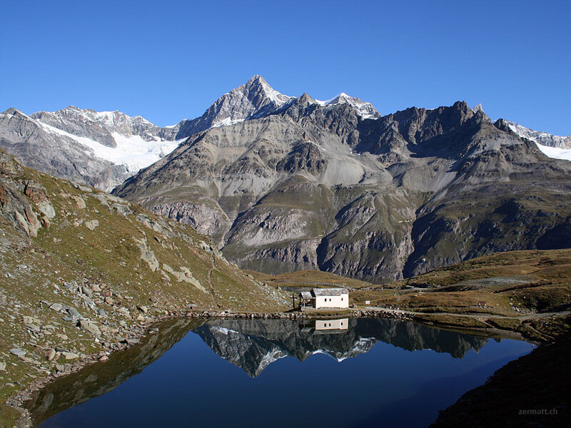 Mountain Hut by Lake — Blue, Serene, Afternoon, Photograph