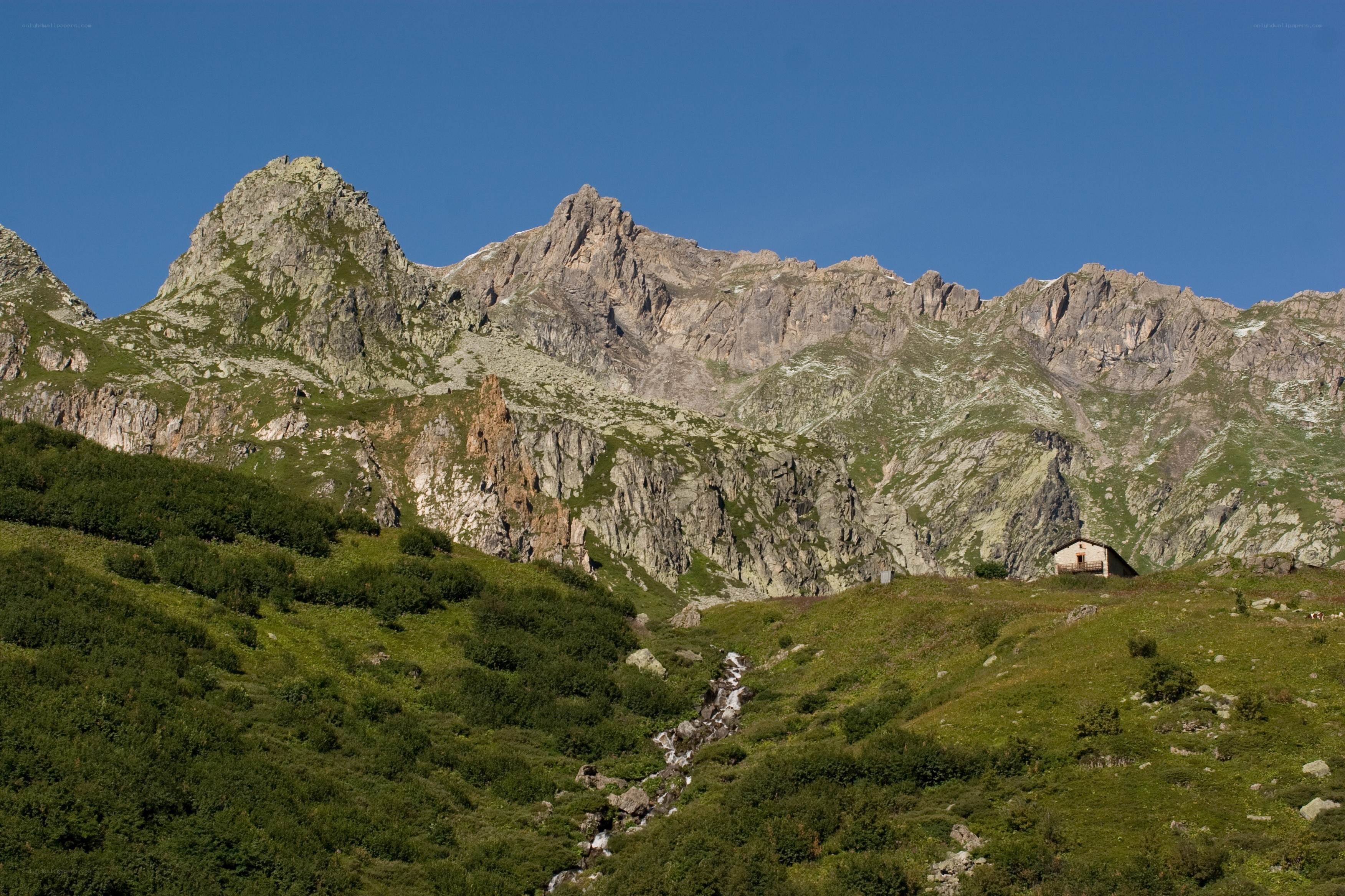 Mountain hut in alpine valley