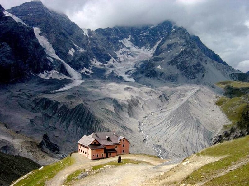 mountain hut in alpine valley