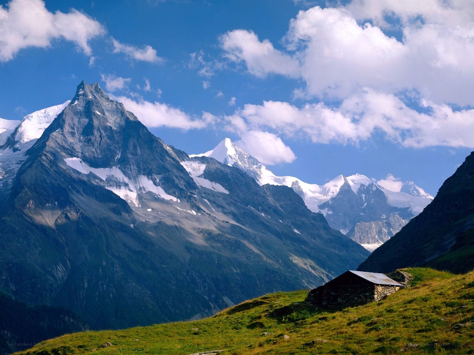 Mountain hut in alpine valley