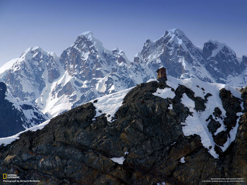 Mountain hut on a snowy peak