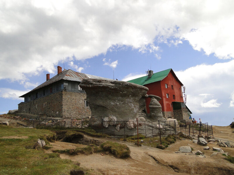 Mountain Hut with Rock Formation