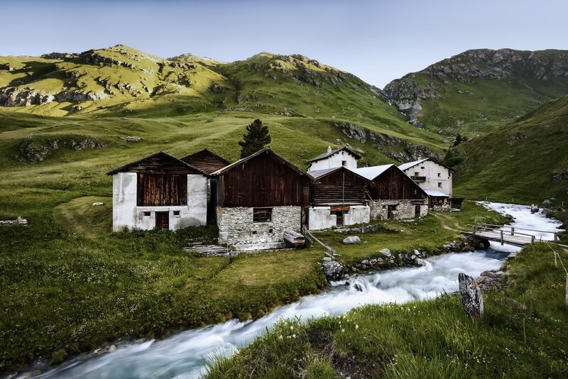 Mountain Huts by River