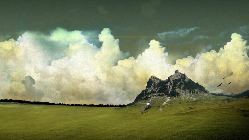 Mountain in Green Field