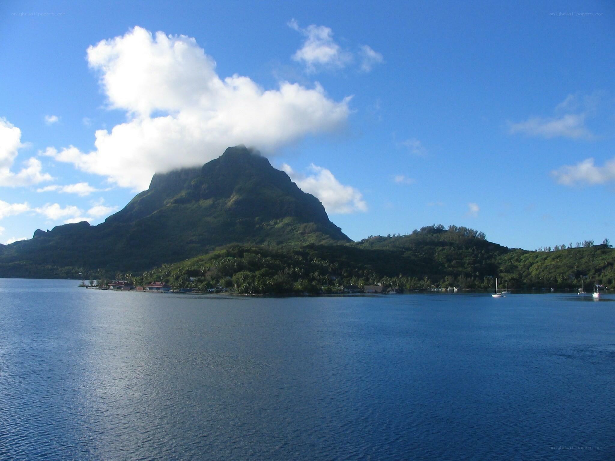 Mountain island with boats