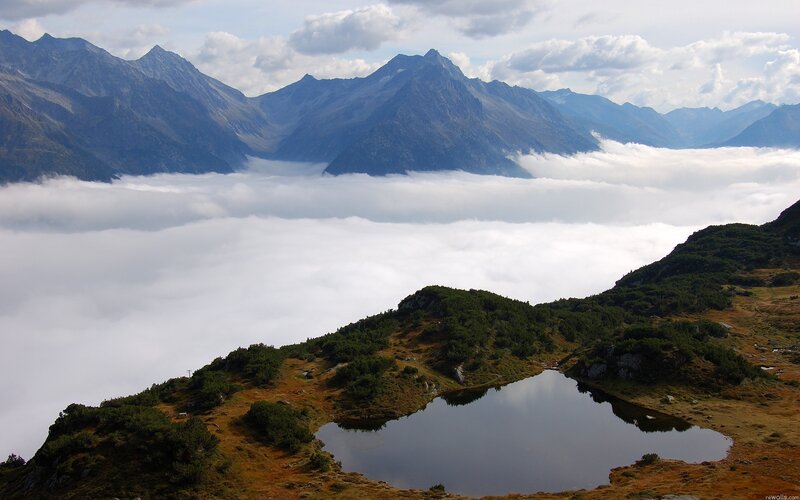 Mountain lake above the clouds
