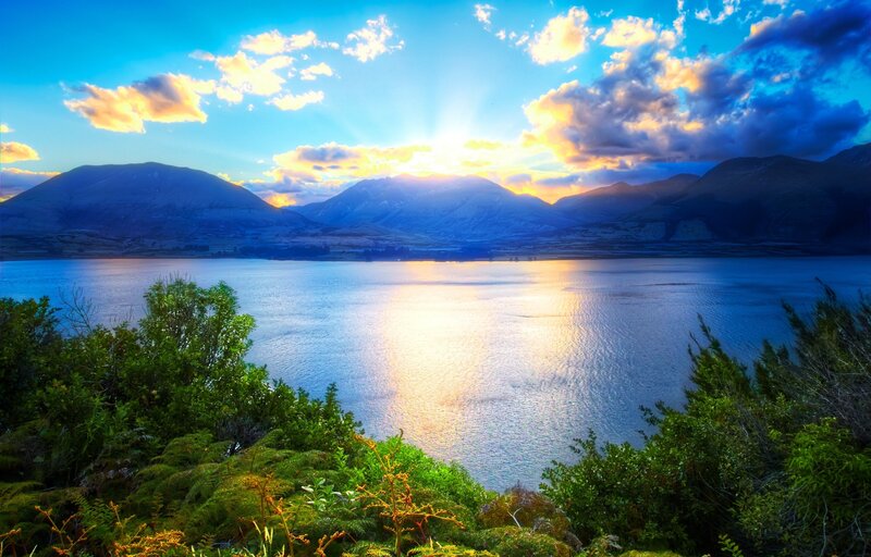 Mountain Lake at Sunset — Blue, Serene, Photograph, Mountains, Clouds, Sunlight, Yellow