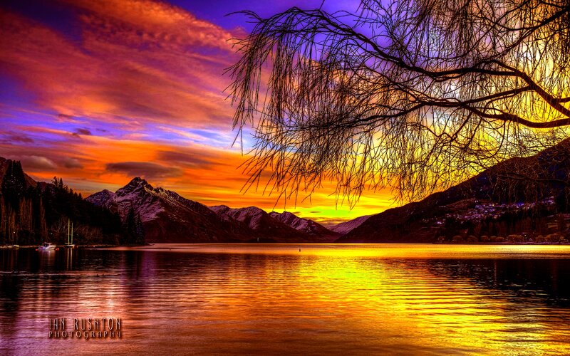 Mountain Lake at Sunset — Orange, Dramatic, Photograph, Mountains, Tree Branches