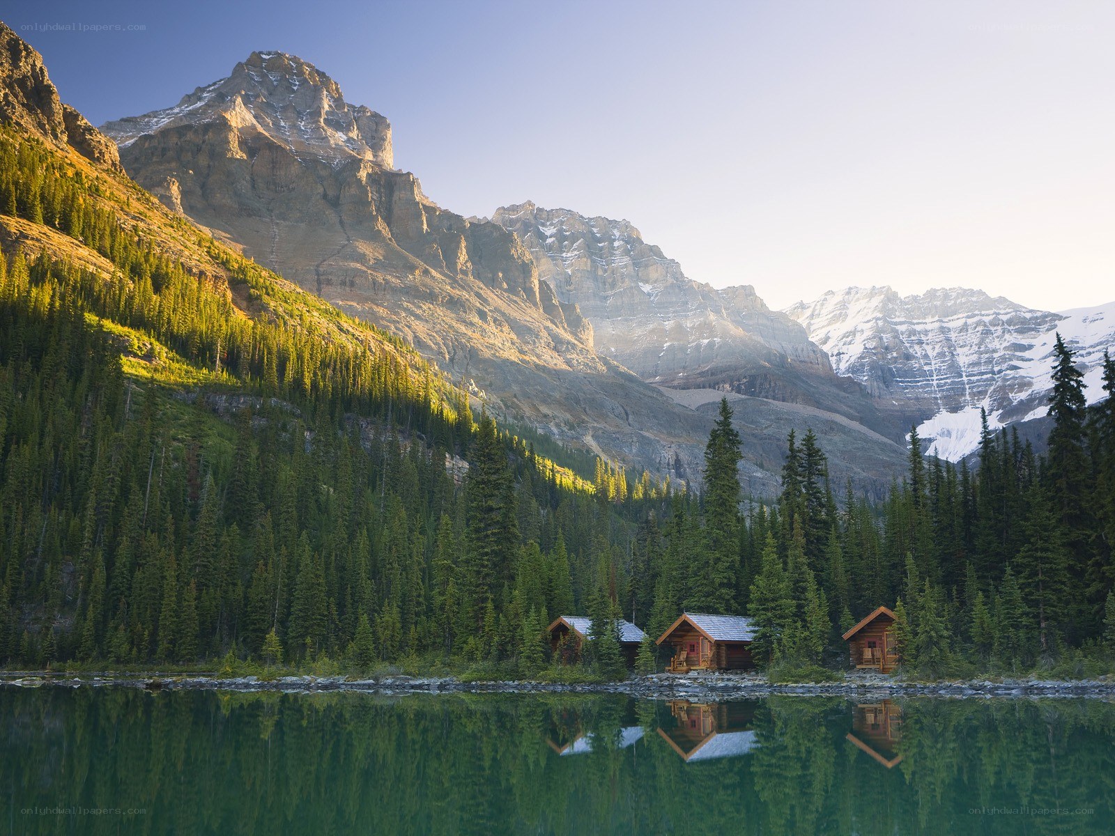 Mountain lake cabins at dawn