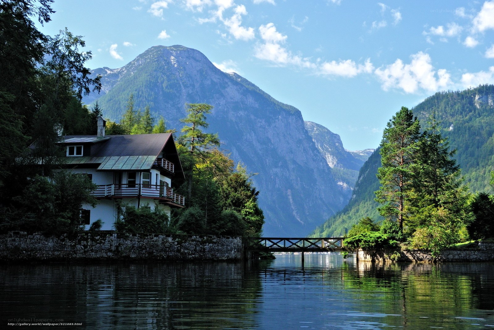 Mountain lake house with bridge