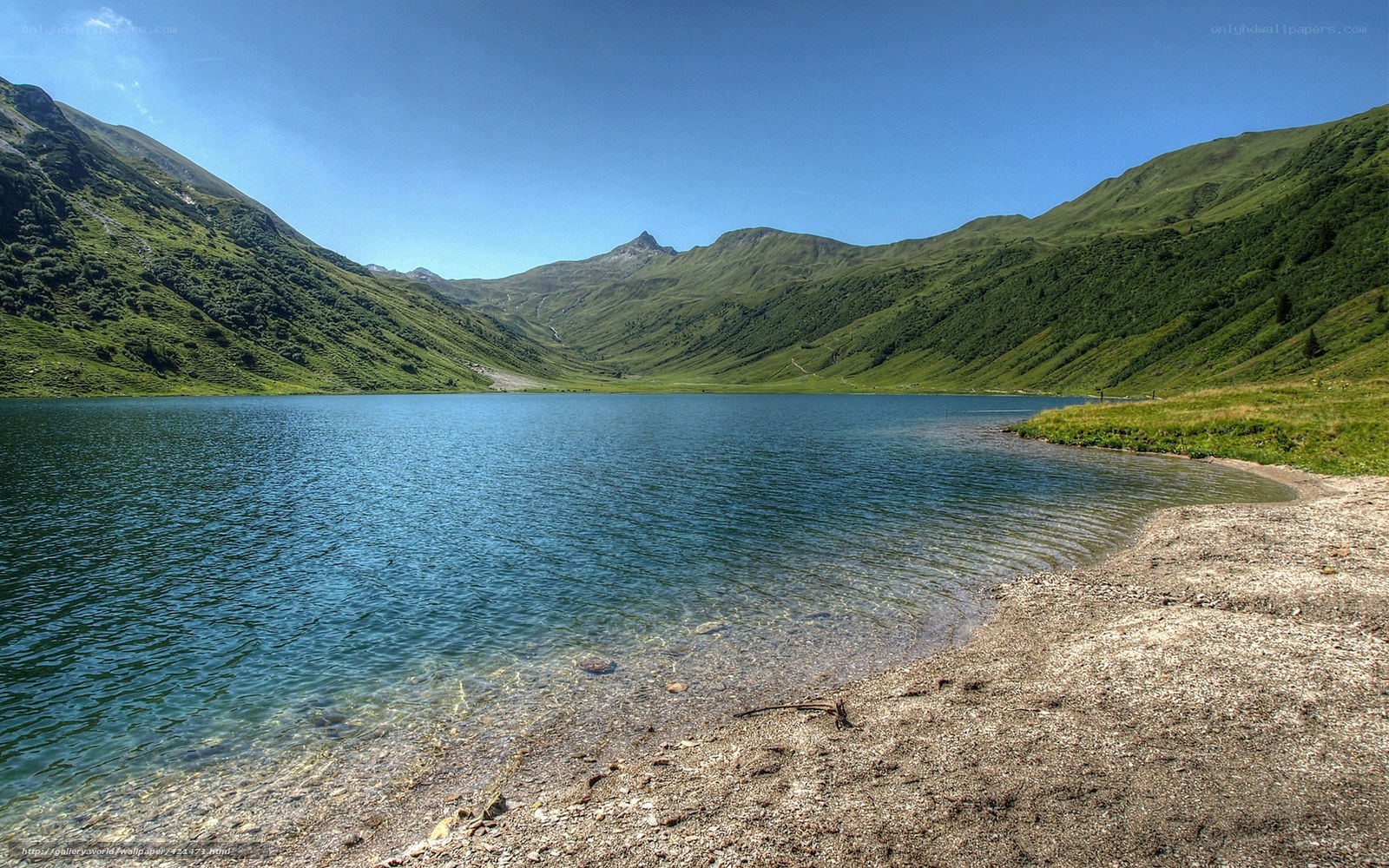 Mountain lake in a green valley