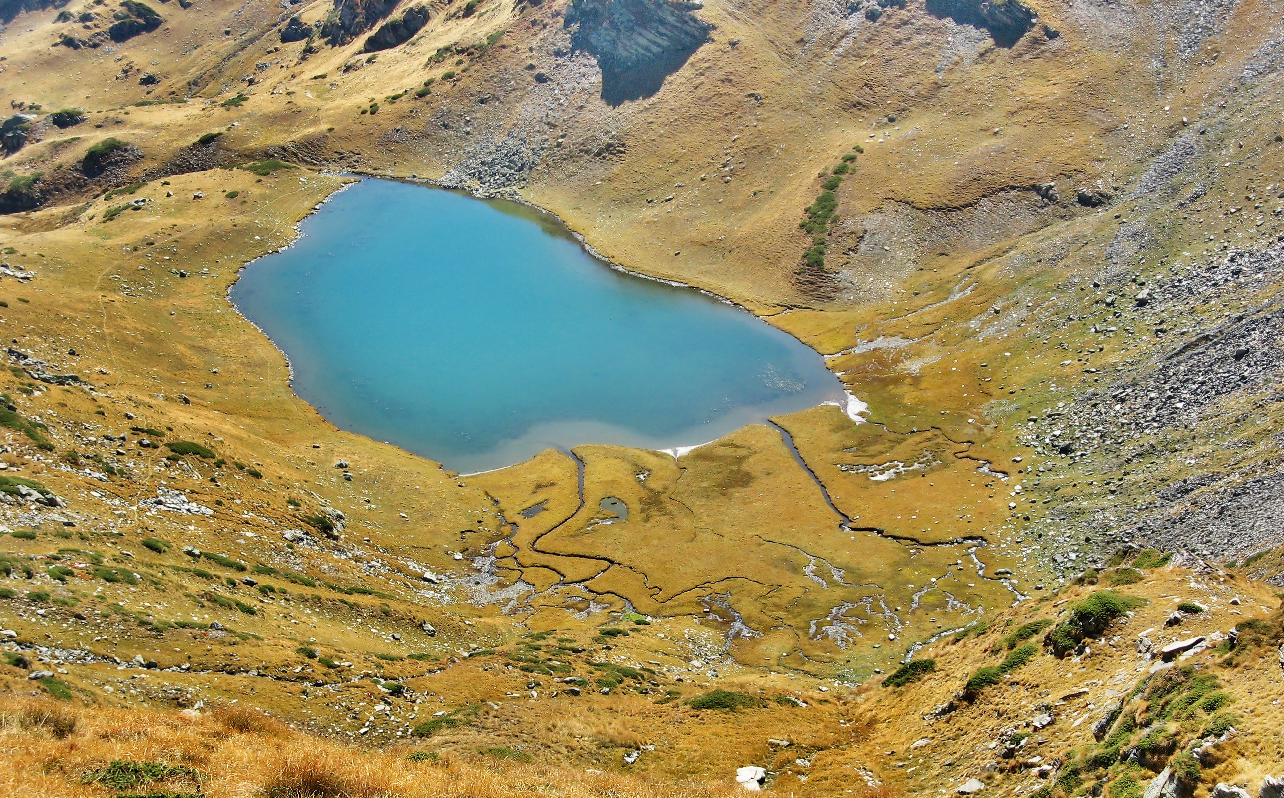 Mountain lake in alpine basin