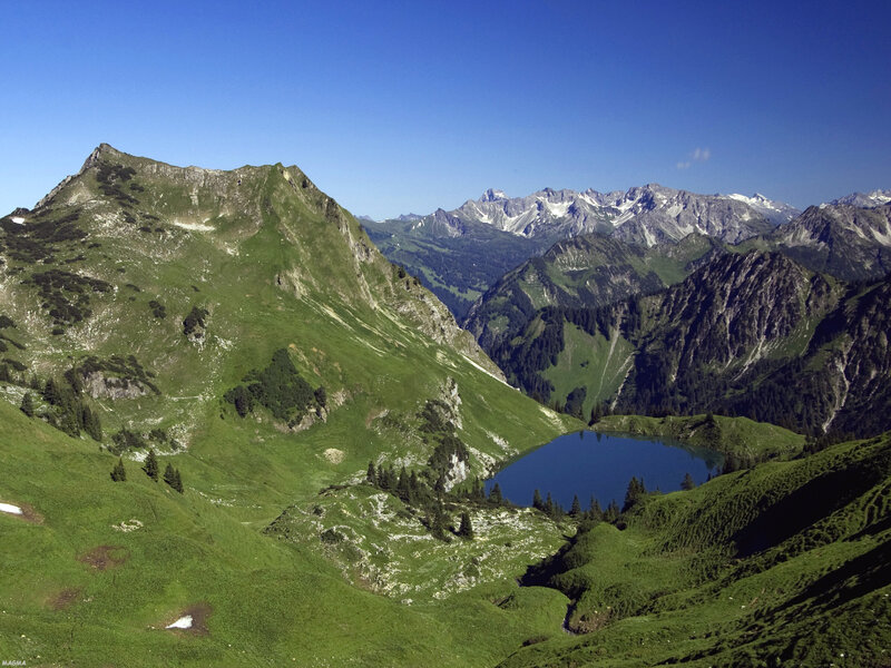 Mountain lake in alpine valley