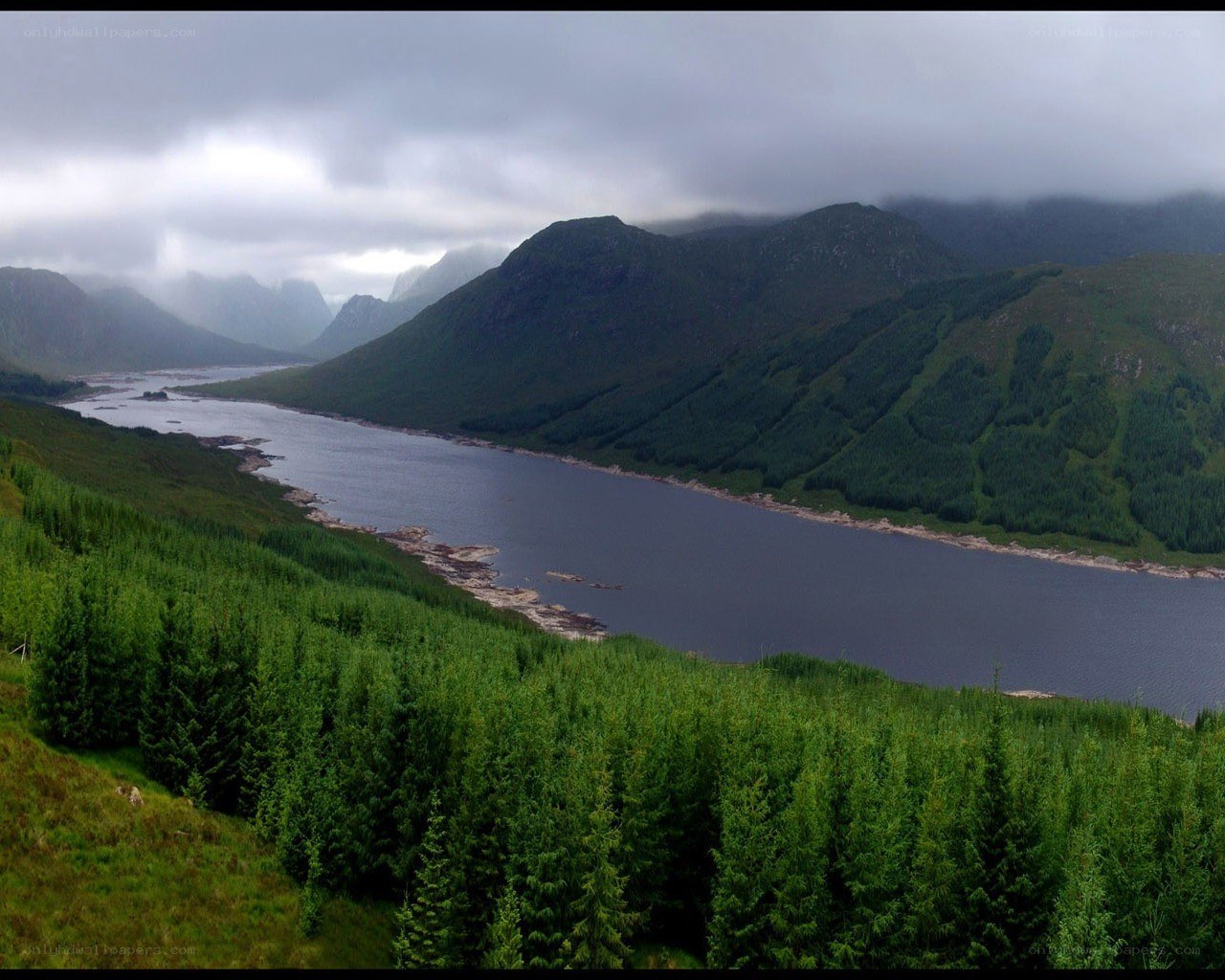 Mountain lake in cloudy weather