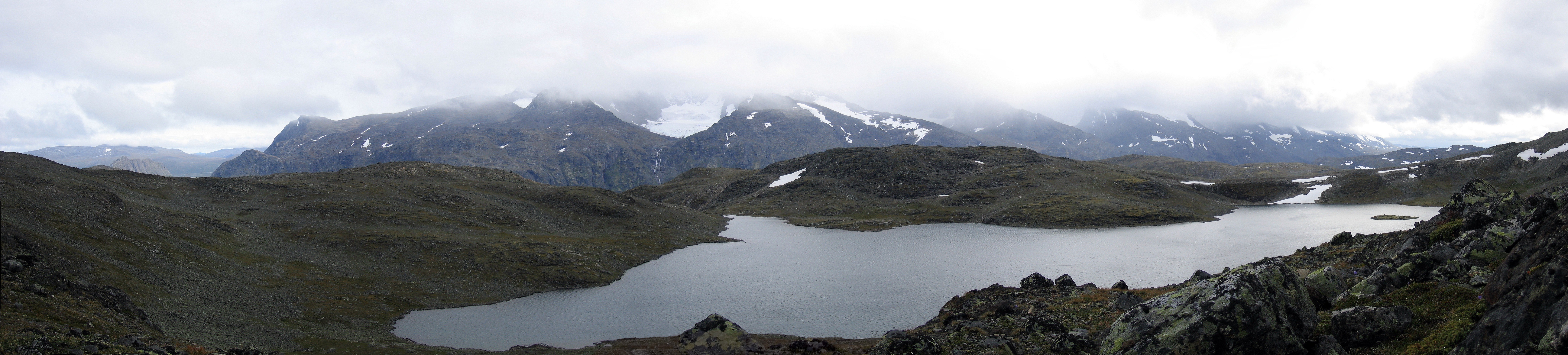 Mountain lake in cloudy weather