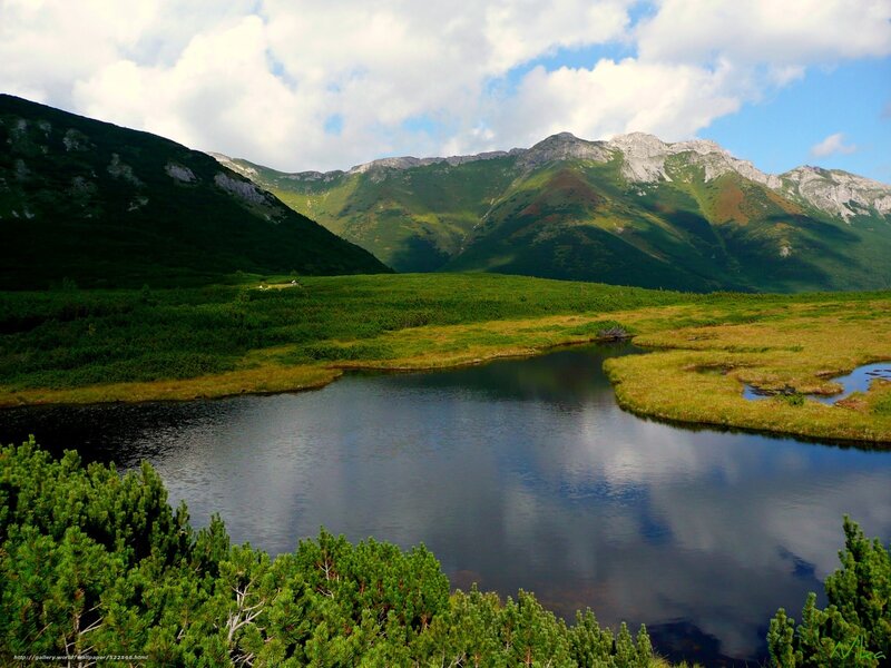 Mountain lake in green valley