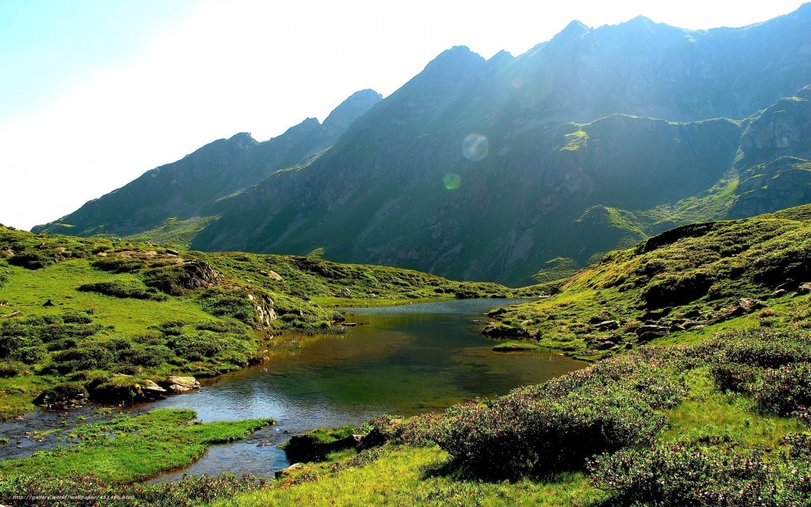 Mountain lake in green valley