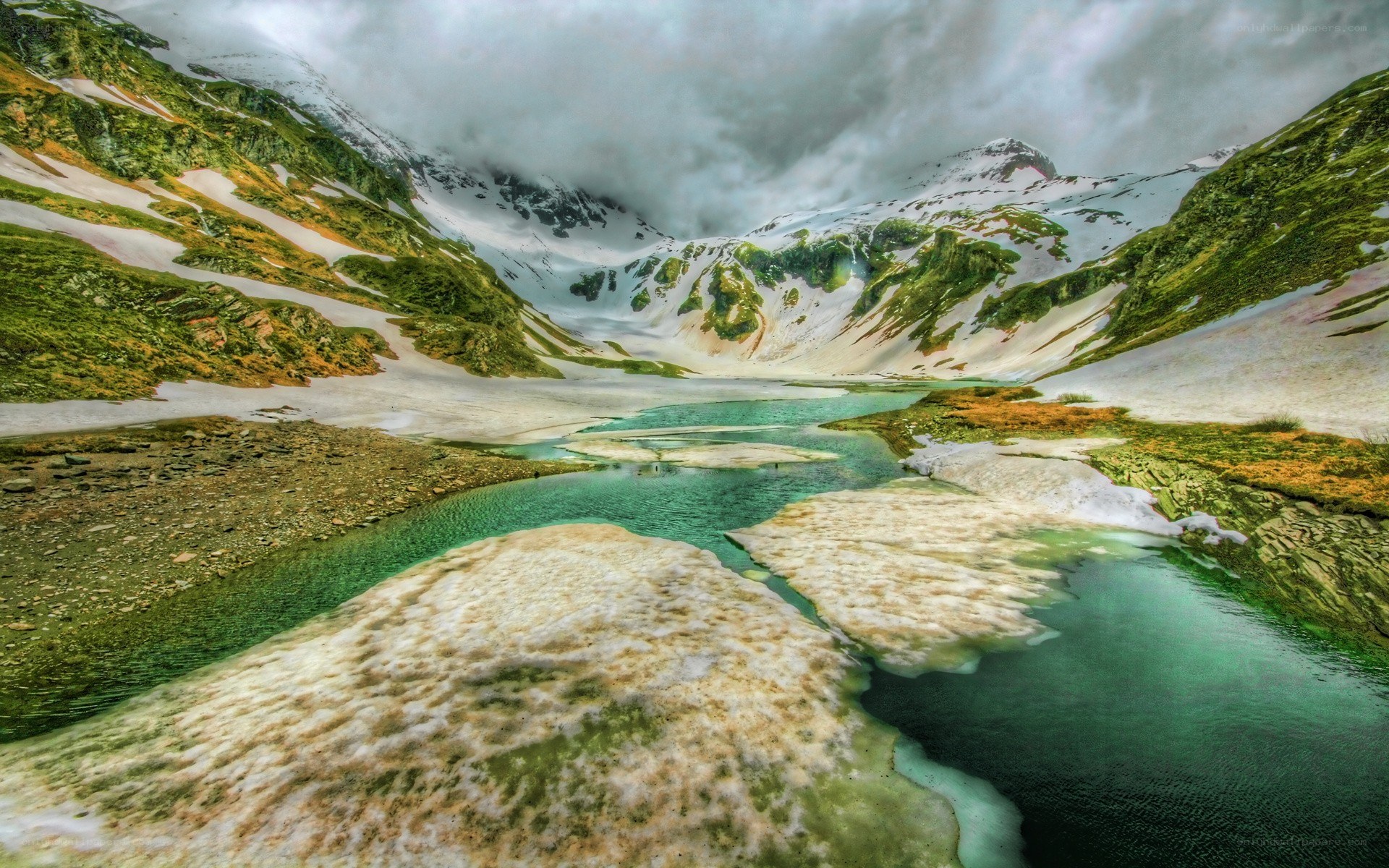 Mountain lake in snow-covered valley