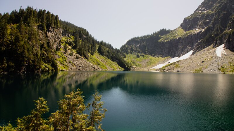 Mountain Lake in Valley — Blue, Serene, Afternoon, Photograph, Trees, Snow Patches