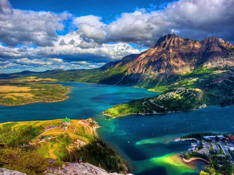Mountain Lake Landscape — Blue, Dramatic, Afternoon, Photograph, Mountains, Clouds, Buildings