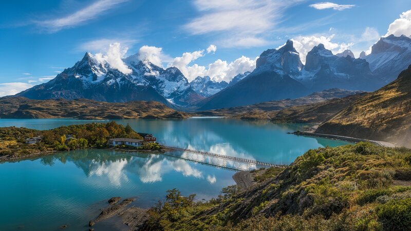 Mountain Lake Landscape — Blue, Serene, Afternoon, Photograph, Mountains, Bridge, Buildings