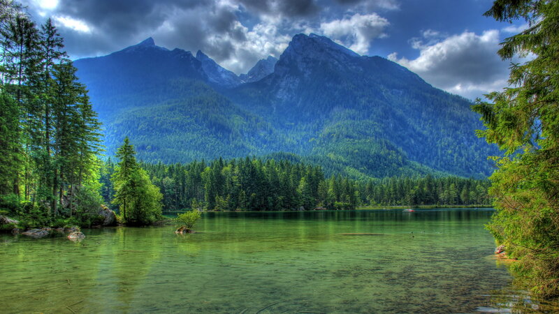 Mountain Lake Landscape — Green, Dramatic, Afternoon, Photograph, Trees, Mountains, Clouds, Boat